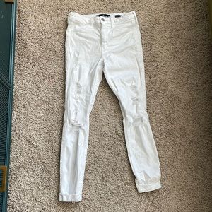 Hollister white skinny jeans with rips